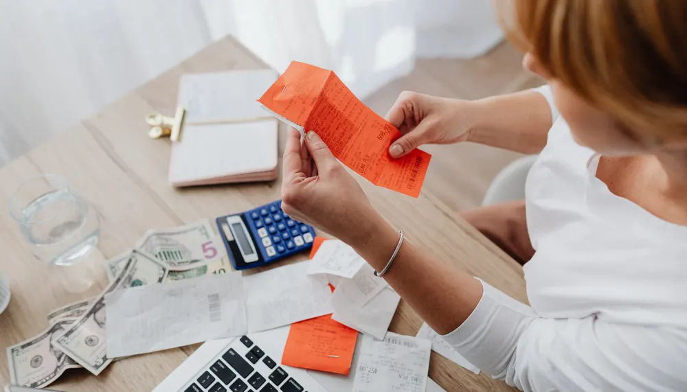 Daily discount and monthly discount merchant processing statements compared side by side.