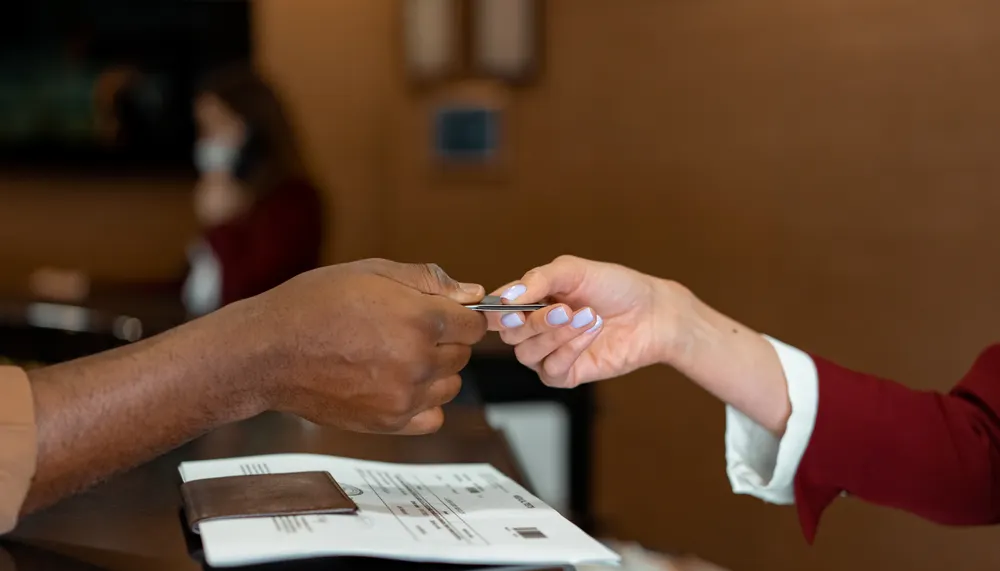 Hotel merchant statement affected by preauthorizations, adjustments, and international card mix.
