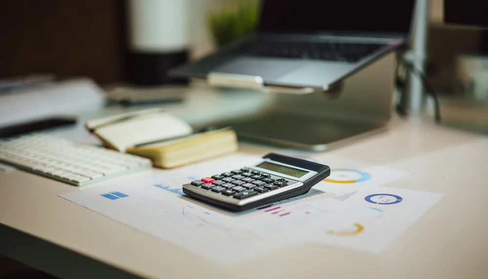 Monthly service fee compared with a monthly processing minimum on a merchant statement.