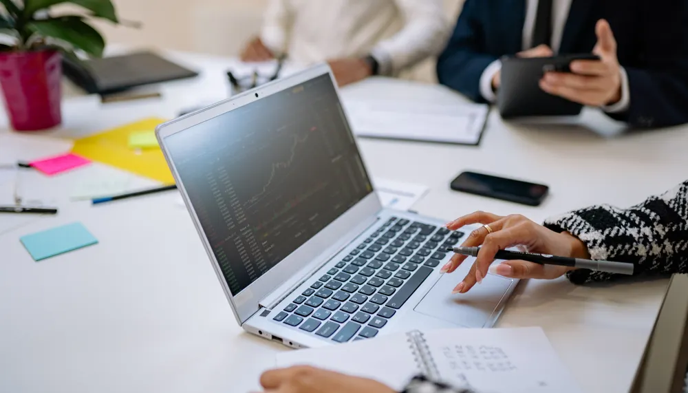Polished merchant-services proposal being checked against its source merchant statement.