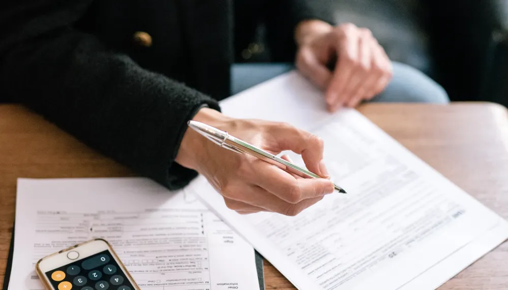 Merchant statement fee total compared with a different bank withdrawal amount.