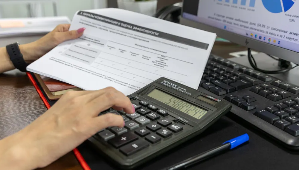 Merchant services quote being prepared from a full processing statement rather than monthly volume alone.